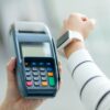 Woman pay by smartwatch with NFC